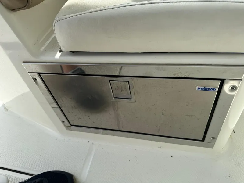 Slide: The Image of Stainless steel compartment on 2018 World Cat Glacier Bay Edition 2740 Dual Console boat. - 17