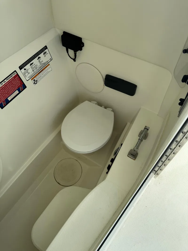 Slide: The Image of 2018 World Cat Glacier Bay Edition 2740 Dual Console boat interior toilet. - 23