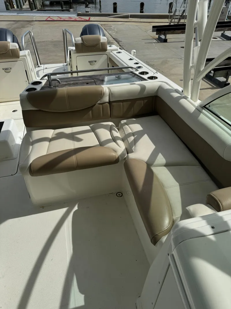 Slide: The Image of 2018 World Cat Glacier Bay Edition 2740 Dual Console boat interior with cushioned seating. - 9