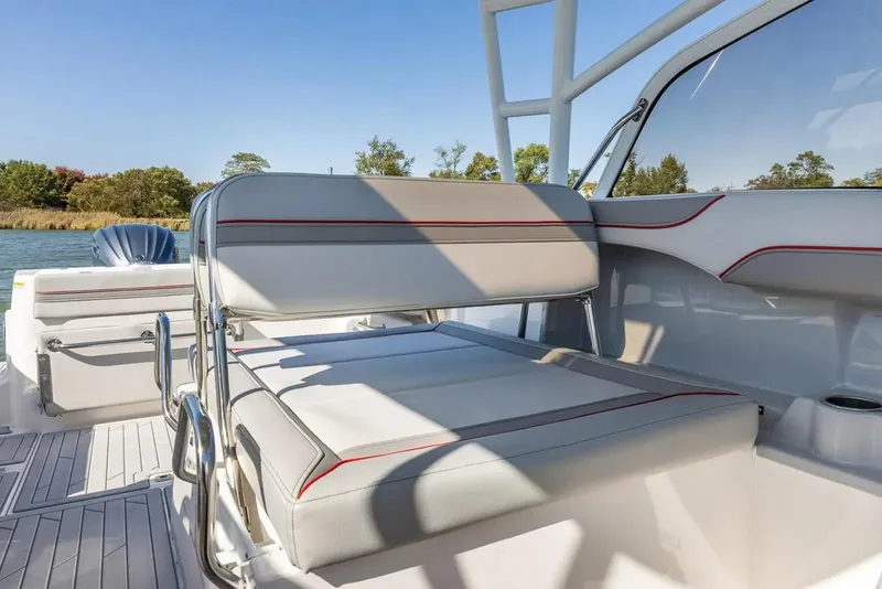 Slide: The Image of 2025 Solara S-250 DC boat interior with cushioned seating and sleek design. - 11