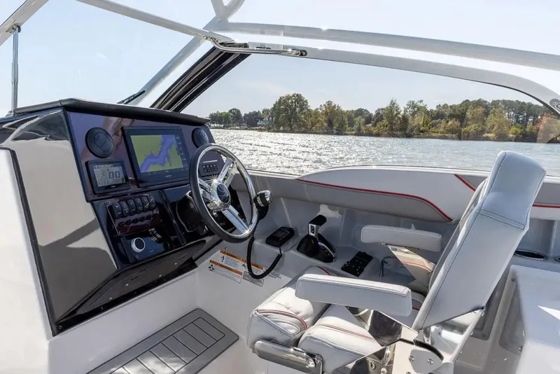 Slide: The Image of Interior of 2025 Solara S-250 DC boat with modern dashboard and steering wheel. - 6