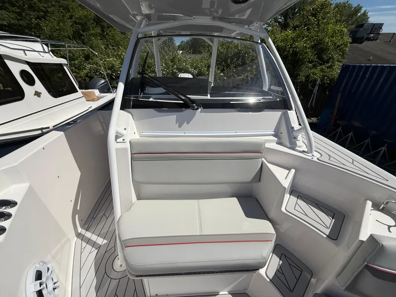 Slide: The Image of 2025 Solara S-250 CW boat interior with white seating and modern design. - 13