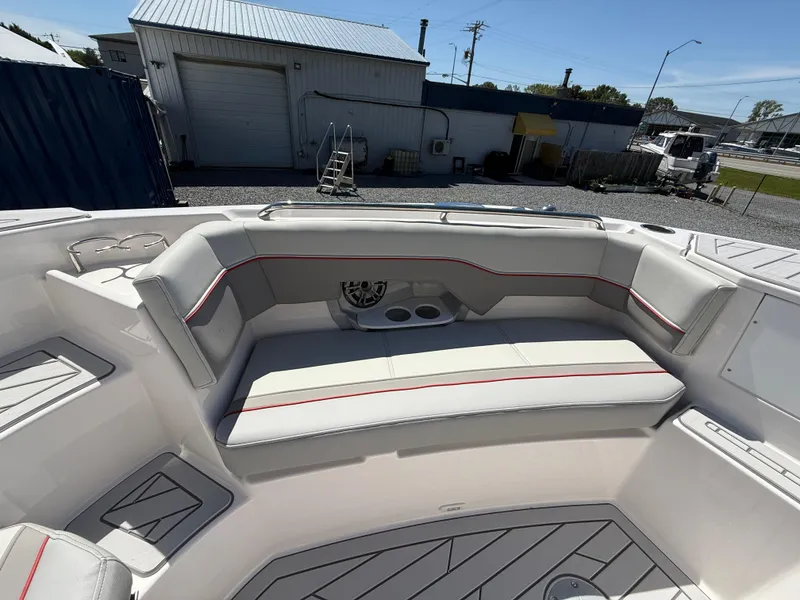 Slide: The Image of 2025 Solara S-250 CW boat interior with cushioned seating and cup holders. - 14
