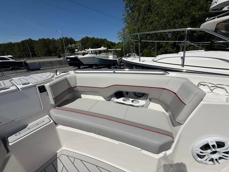 Slide: The Image of 2025 Solara S-250 CW boat seating area with cup holders and sleek design. - 15