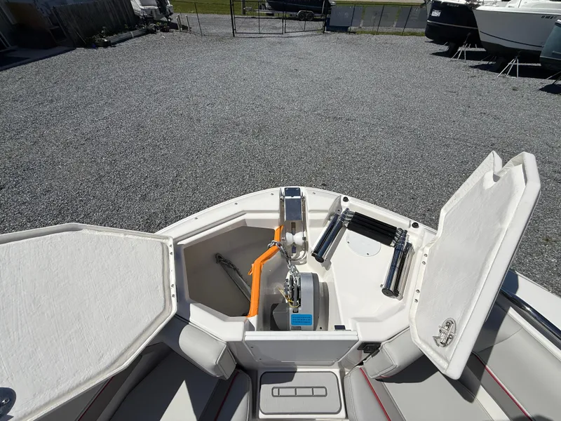 Slide: The Image of 2025 Solara S-250 CW boat anchor compartment with open hatch, showcasing storage and equipment. - 16