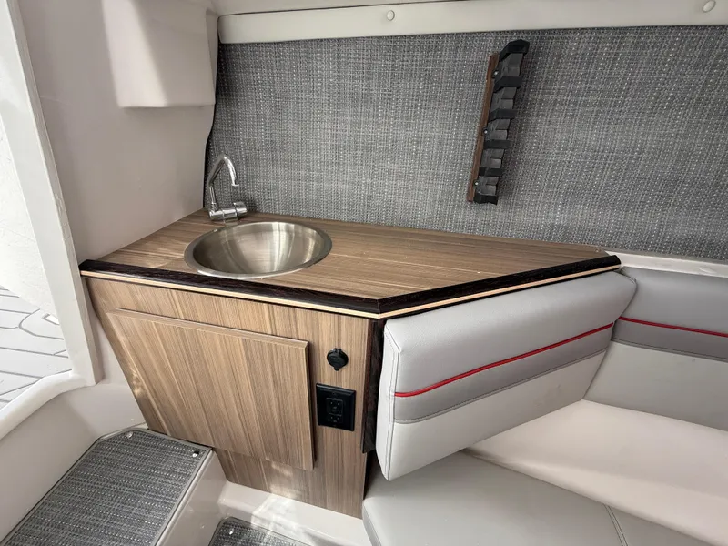 Slide: The Image of Compact kitchenette in 2025 Solara S-250 CW boat with sink and modern design. - 18