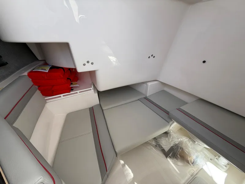 Slide: The Image of 2025 Solara S-250 CW boat interior with gray seating and red life jackets. - 19