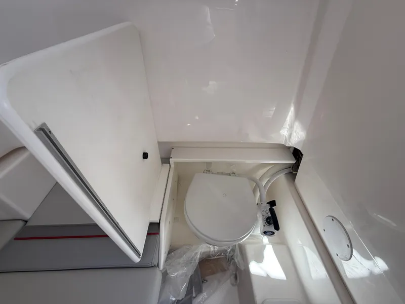 Slide: The Image of Compact marine toilet in 2025 Solara S-250 CW boat interior. - 20