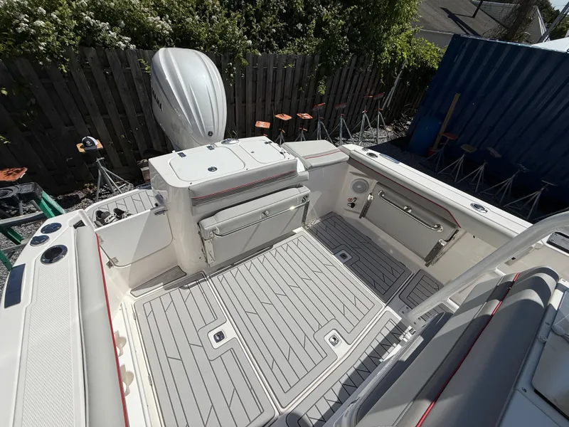 Slide: The Image of 2025 Solara S-250 CW boat deck with seating and storage compartments. - 22