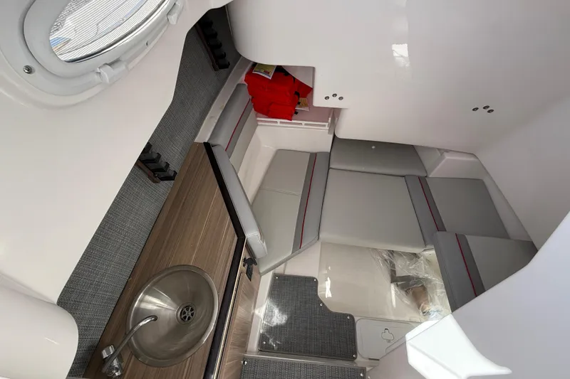 Slide: The Image of Interior cabin of 2025 Solara S-250 CW boat with seating and sink. - 23