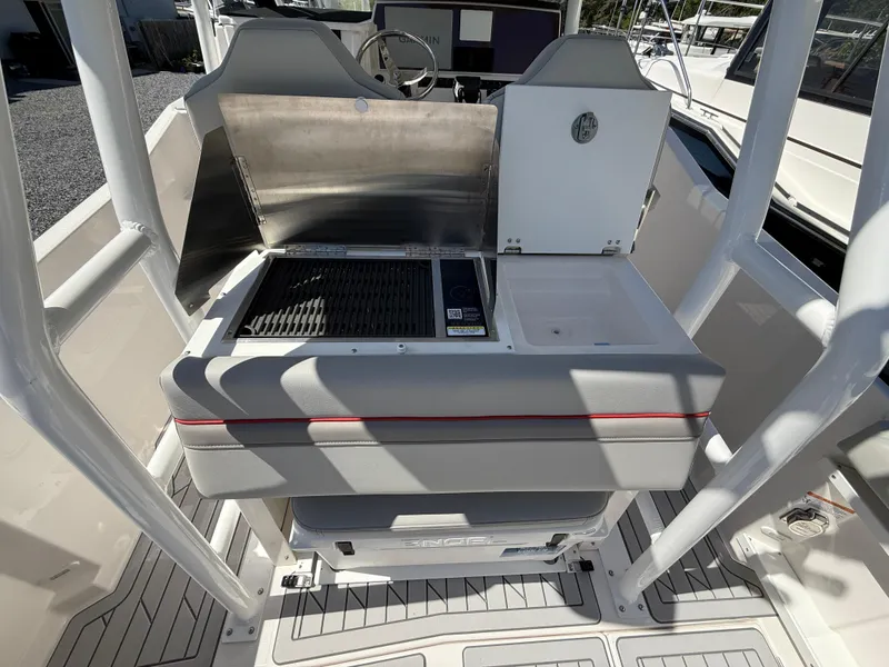 Slide: The Image of 2025 Solara S-250 CW boat interior with grill and storage area. - 7