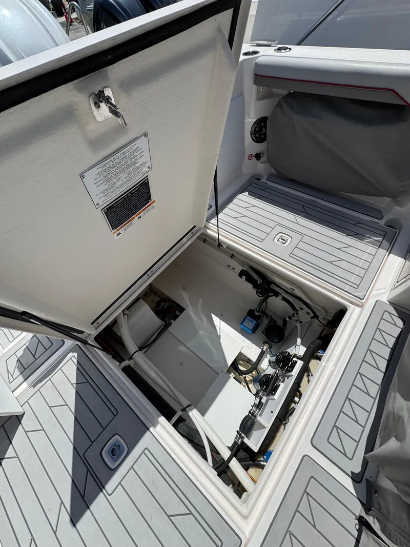 Slide: The Image of Open hatch of 2025 Solara S-310 SC boat showing internal components. - 14