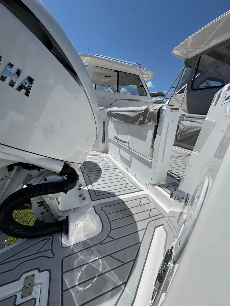 Slide: The Image of 2025 Solara S-310 SC boat deck with Yamaha engine, showcasing sleek design and modern features. - 5
