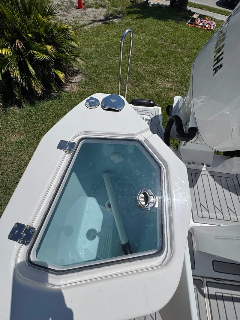 Slide: The Image of 2025 Solara S-310 SC boat with open hatch, showcasing sleek design and modern features. - 7