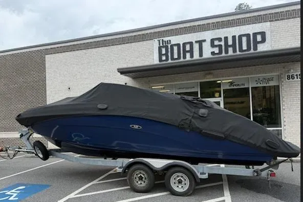 Slide: The Image of 2012 Yamaha Boats 242 Limited covered on trailer outside The Boat Shop. - 1