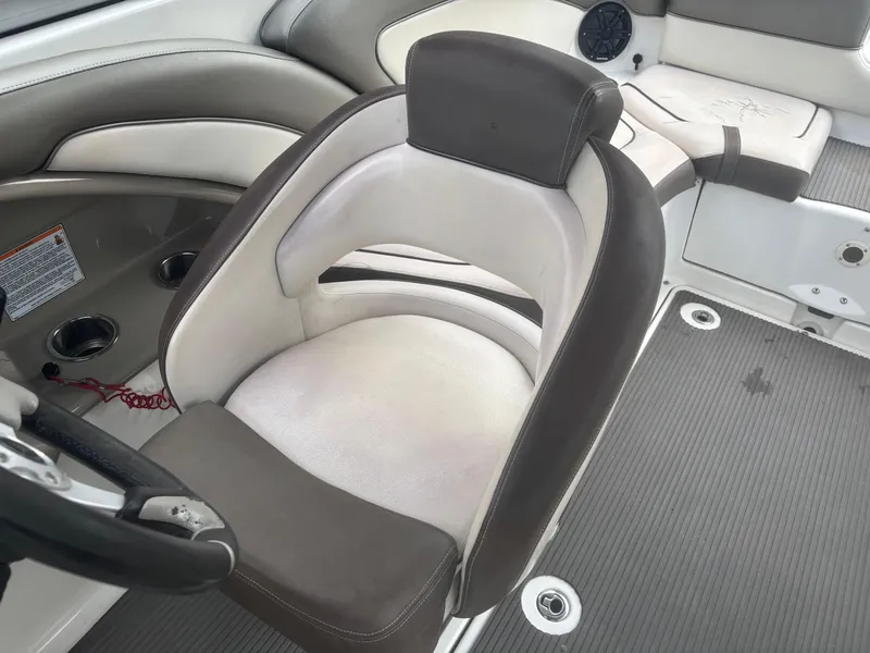 Slide: The Image of Captain's seat on 2012 Yamaha Boats 242 Limited, featuring sleek design and comfortable upholstery. - 12