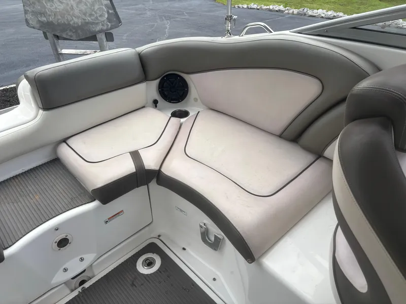 Slide: The Image of 2012 Yamaha Boats 242 Limited interior seating with gray and white upholstery. - 14
