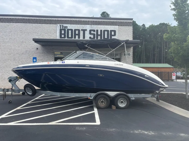 Slide: The Image of 2012 Yamaha Boats 242 Limited on trailer outside The Boat Shop. - 2