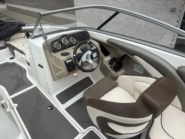 Slide: The Image of 2012 Yamaha Boats 242 Limited cockpit with steering wheel and dashboard controls. - 8