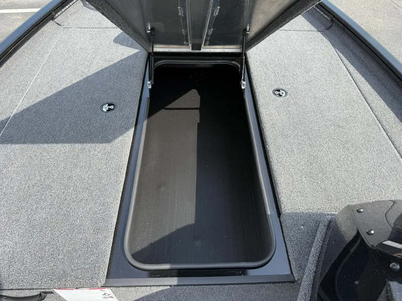 Slide: The Image of 2024 Crestliner XF 189 boat with open storage compartment, showcasing spacious interior. - 4