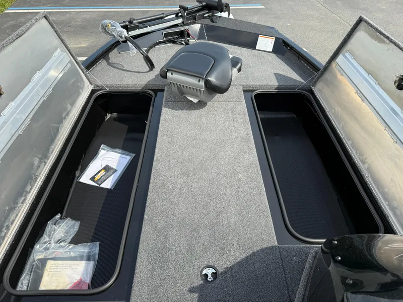 Slide: The Image of 2024 Crestliner XF 189 boat interior with open storage compartments and seating. - 5