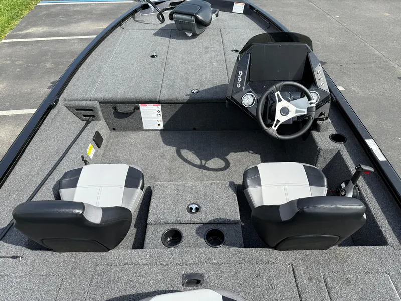 Slide: The Image of 2024 Crestliner XF 189 boat interior with steering wheel and seating. - 8