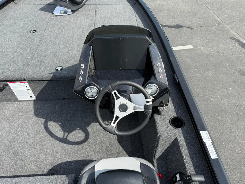 Slide: The Image of 2024 Crestliner XF 189 boat cockpit with steering wheel and dashboard controls. - 9