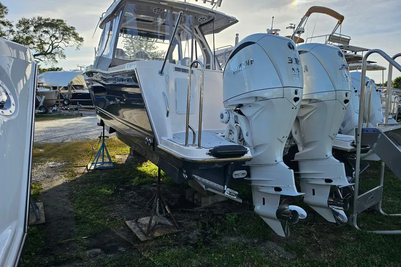 Slide: The Image of 2025 Solara S-310 CW boat with dual Yamaha outboard engines on display. - 4