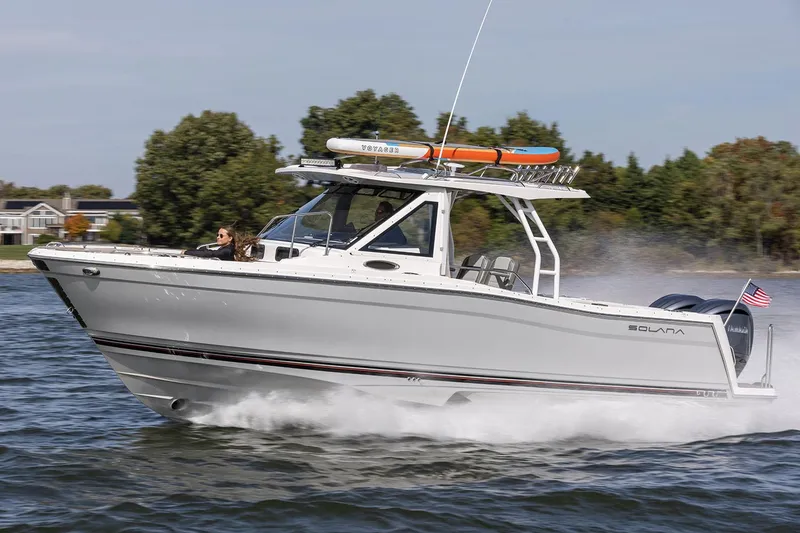 Slide: The Image of 2025 Solara S-310 CW boat with sleek design, docked under clear skies. - 5