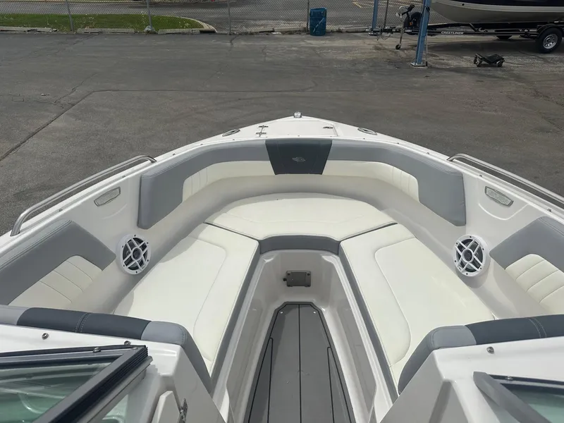 Slide: The Image of 2023 Chaparral 23 SSi boat interior with white and gray seating. - 5