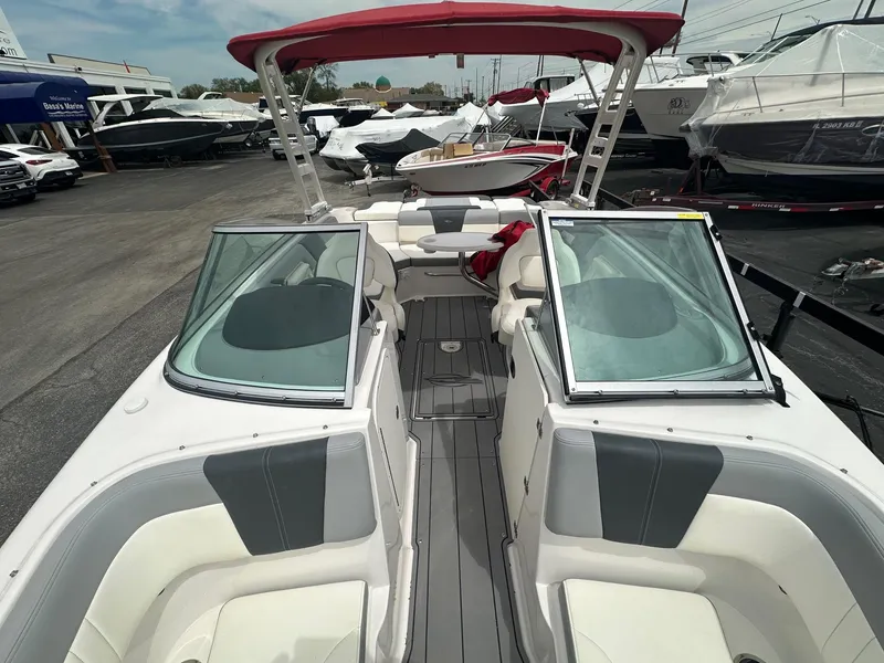 Slide: The Image of 2023 Chaparral 23 SSi boat with red canopy and spacious seating. - 6