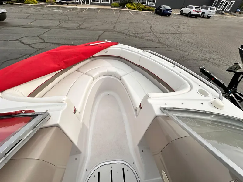 Slide: The Image of 2004 Four Winns 200 Horizon Open Bow boat with white seating and red cover. - 6