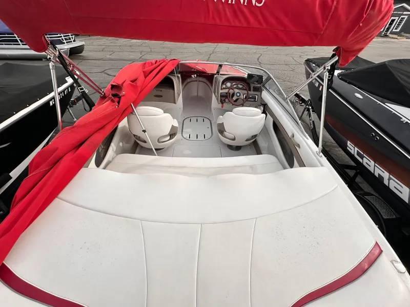 Slide: The Image of 2004 Four Winns 200 Horizon Open Bow boat with red canopy and white interior. - 7