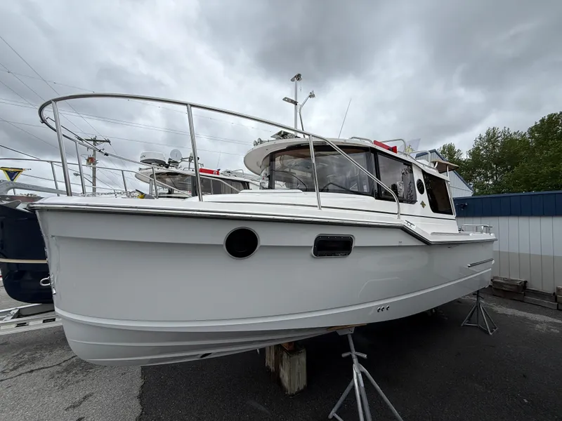 The Image of 2025 Ranger Tugs R-23 boat on display, overcast sky background. - 1