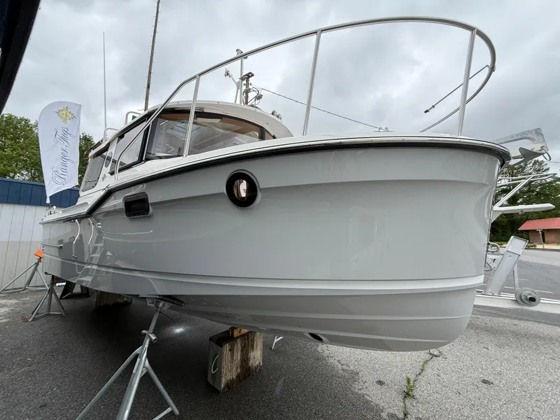 Slide: The Image of 2025 Ranger Tugs R-23 boat on display, showcasing sleek design and modern features. - 3