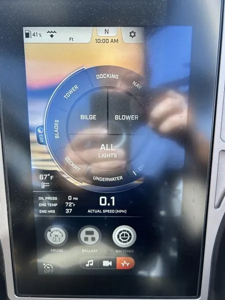 Slide: The Image of 2023 Tigé 22RZX touchscreen display showing boat controls and settings. - 6