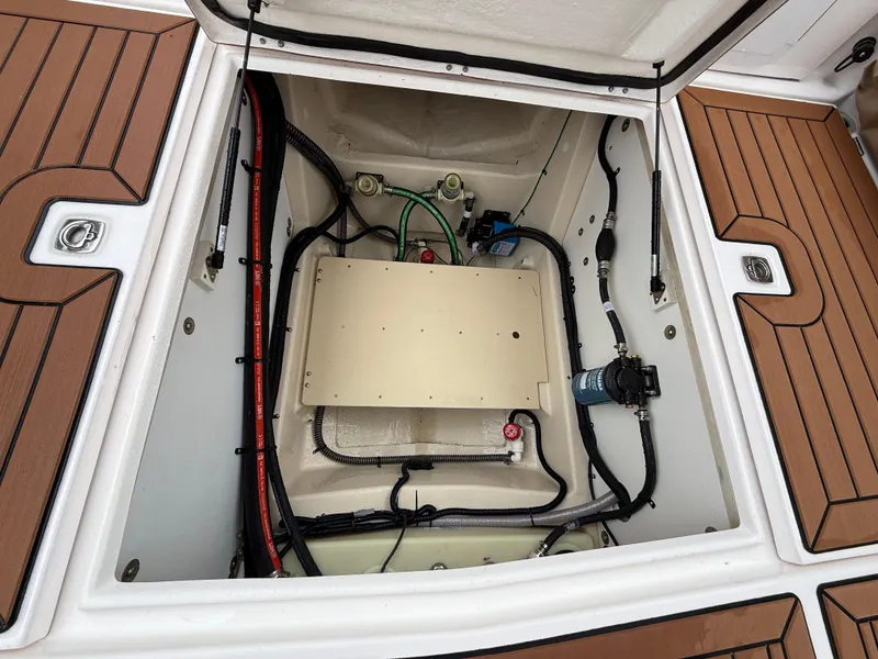 Slide: The Image of Engine compartment of 2025 Ranger Tugs R-25 boat, showcasing wiring and components. - 24