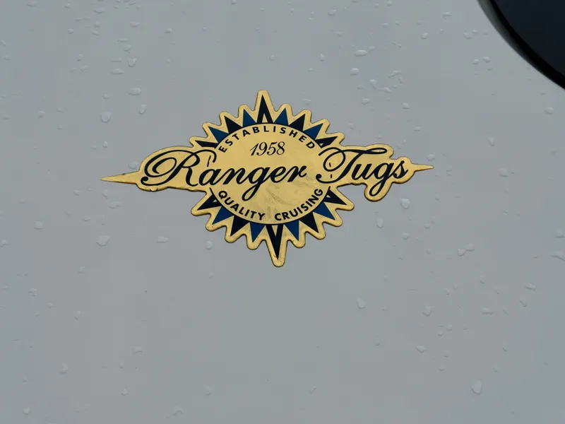 Slide: The Image of Ranger Tugs logo on 2025 R-25 model, emphasizing quality cruising since 1958. - 26