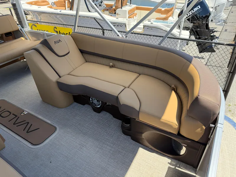 Slide: The Image of 2025 Avalon Catalina Entertainer Funship boat interior with tan seating and modern design. - 11