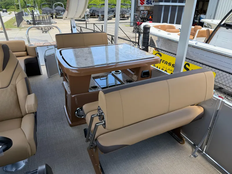 Slide: The Image of 2025 Avalon Catalina Entertainer Funship interior with seating and table, showcasing luxury design. - 14