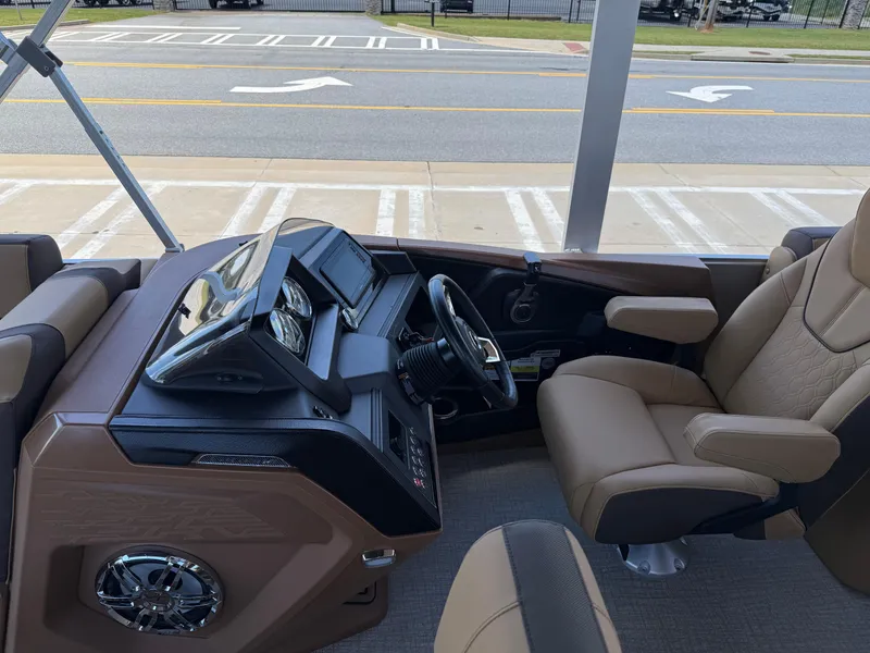 Slide: The Image of 2025 Avalon Catalina Entertainer Funship helm with modern controls and comfortable seating. - 16