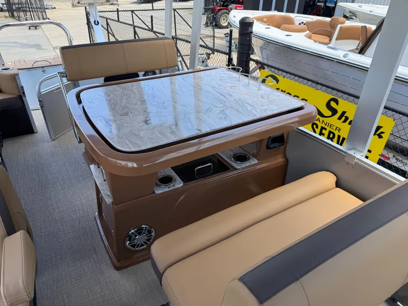 Slide: The Image of 2025 Avalon Catalina Entertainer Funship interior with sleek table and comfortable seating. - 19