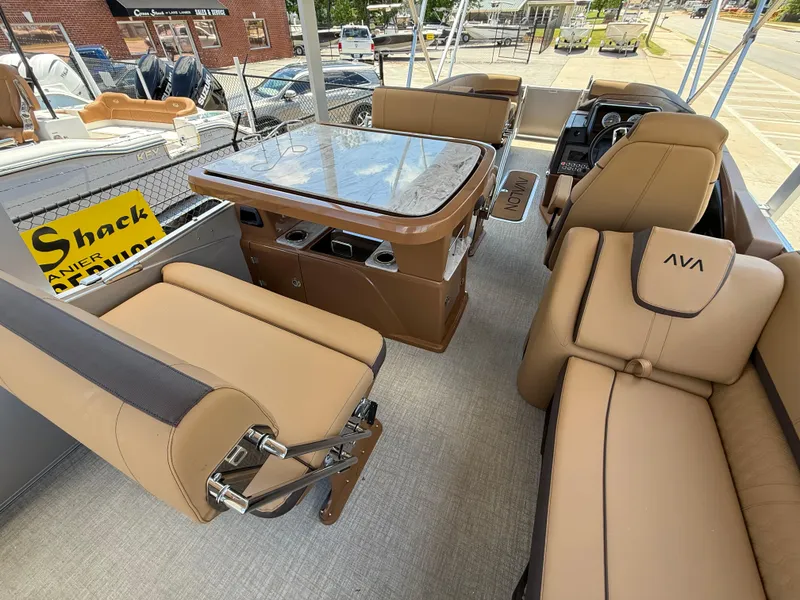 Slide: The Image of 2025 Avalon Catalina Entertainer Funship interior with tan seating and a central table. - 26