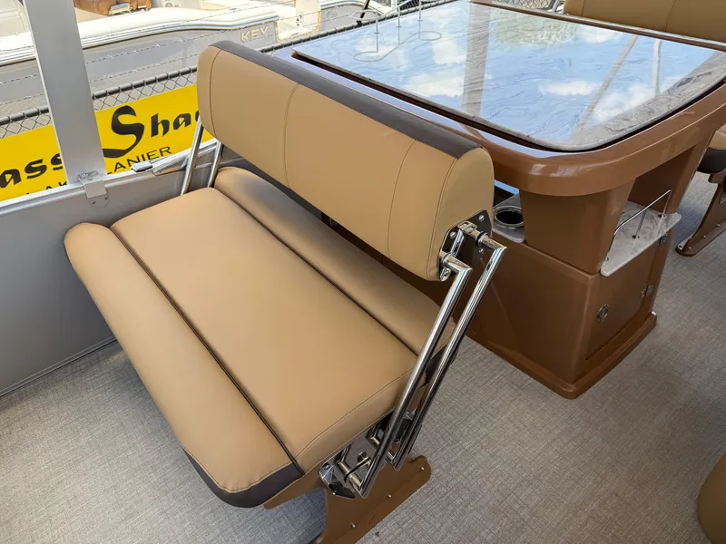 Slide: The Image of 2025 Avalon Catalina Entertainer Funship interior with tan seating and table. - 27