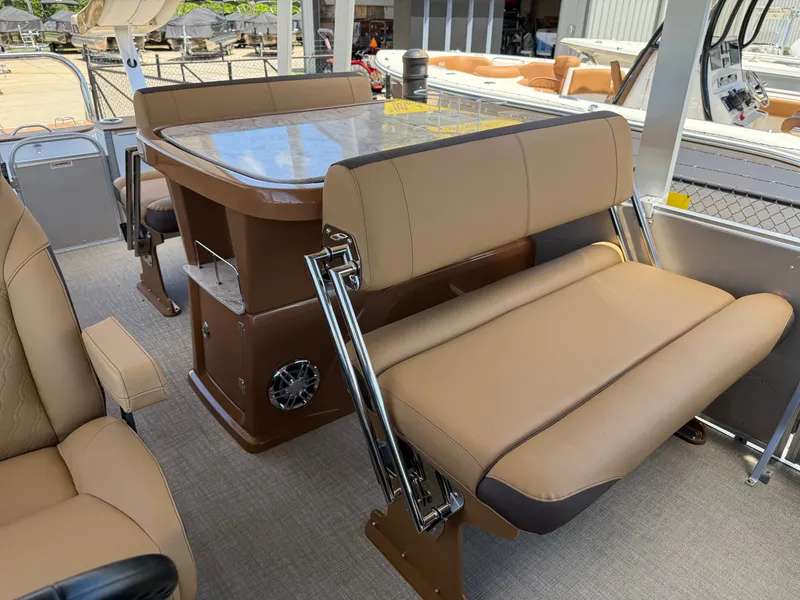 Slide: The Image of 2025 Avalon Catalina Entertainer Funship interior with tan seating and table. - 29
