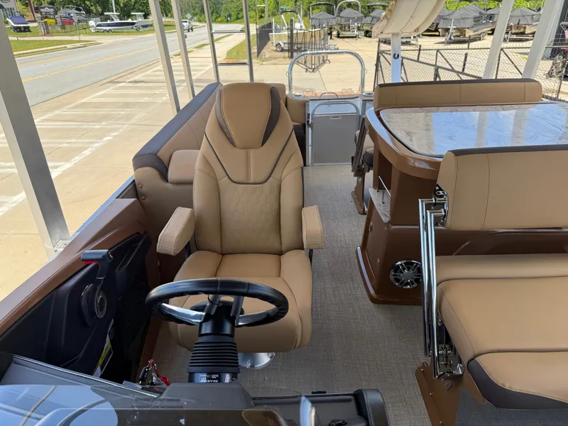 Slide: The Image of 2025 Avalon Catalina Entertainer Funship interior with luxurious seating and steering wheel. - 30