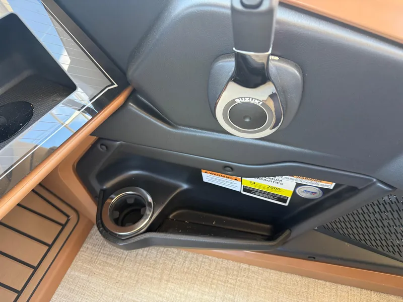 Slide: The Image of 2025 Avalon Catalina Entertainer Funship interior detail with cup holder and control panel. - 36