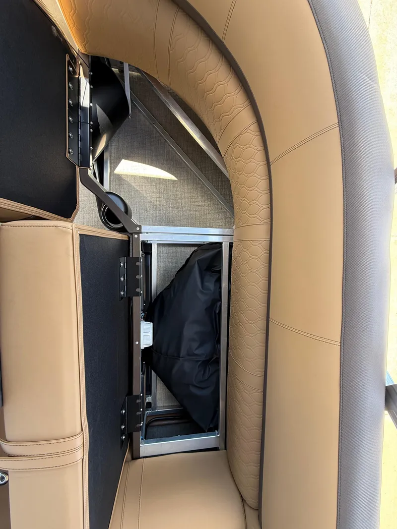 Slide: The Image of 2025 Avalon Catalina Entertainer Funship interior seating with storage compartment. - 44