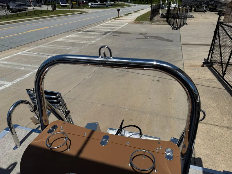 Slide: The Image of 2025 Avalon Catalina Entertainer Funship boat parked on a sunny street. - 46