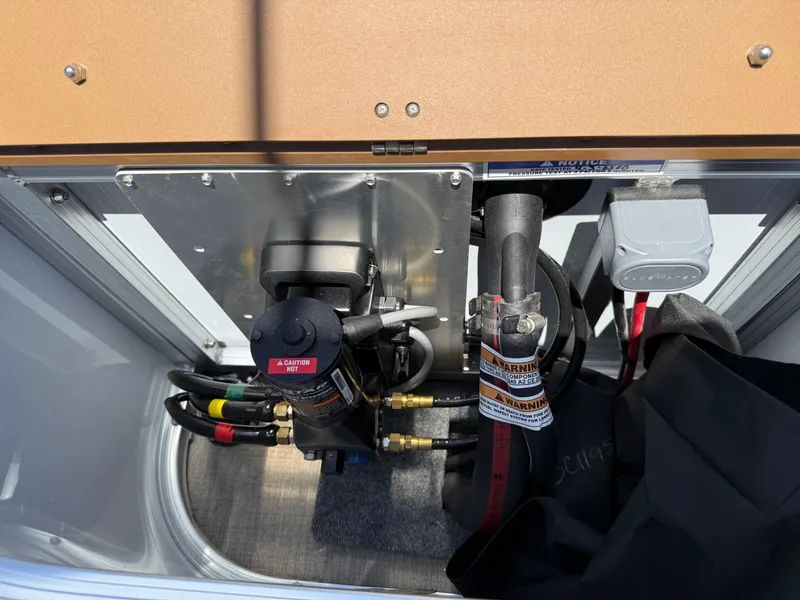 Slide: The Image of Engine compartment of 2025 Avalon Catalina Entertainer Funship, showcasing mechanical components and wiring. - 47